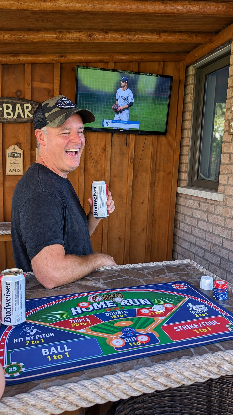 Mike, founder of Baseball Roulette, laughing beside the game table